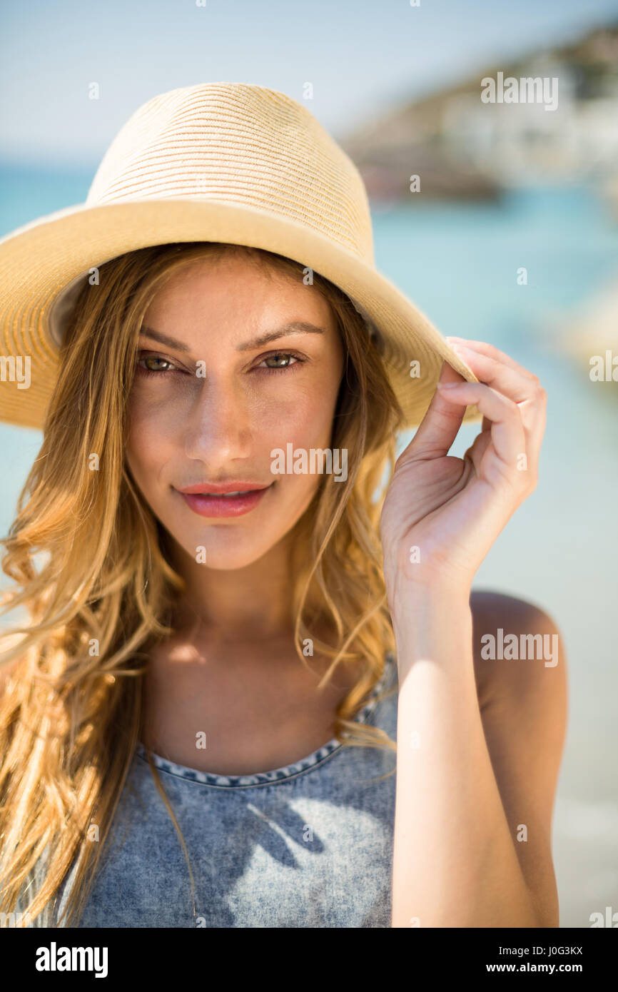 Close up portrait of young woman wearing sun hat on sunny day Stock ...