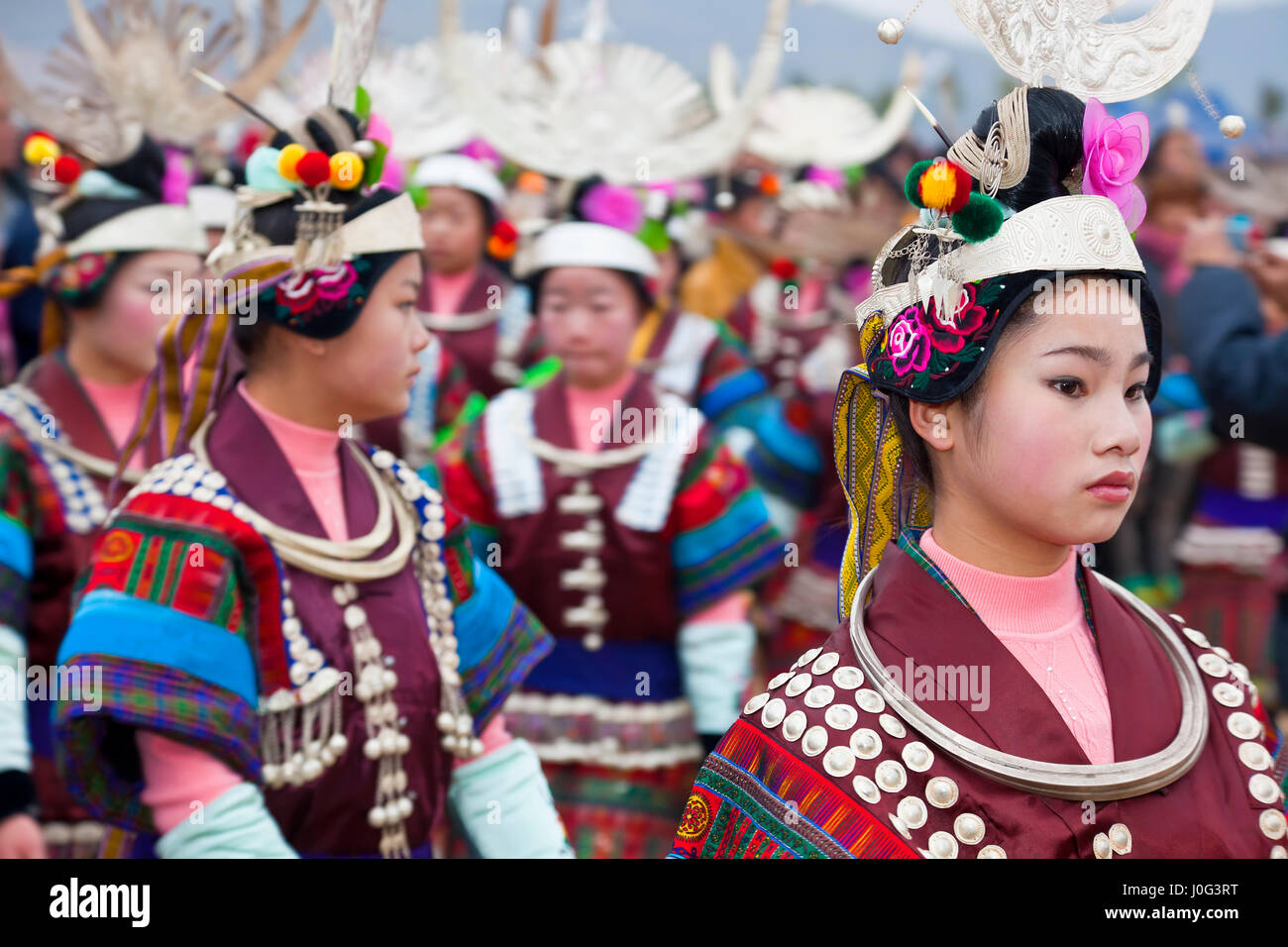 Black Miao girls dancing at festival, Kaili, Guizhou Province, China Stock Photo