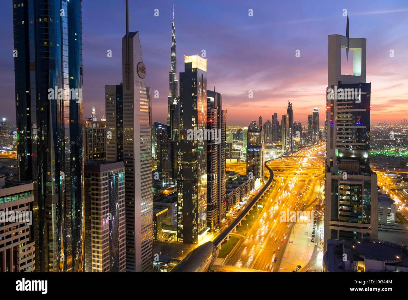 Elevated view at dusk over Downtown & Sheikh Zayed Road looking towards the Burj Kalifa, Dubai, United Arab Emirates, UAE Stock Photo