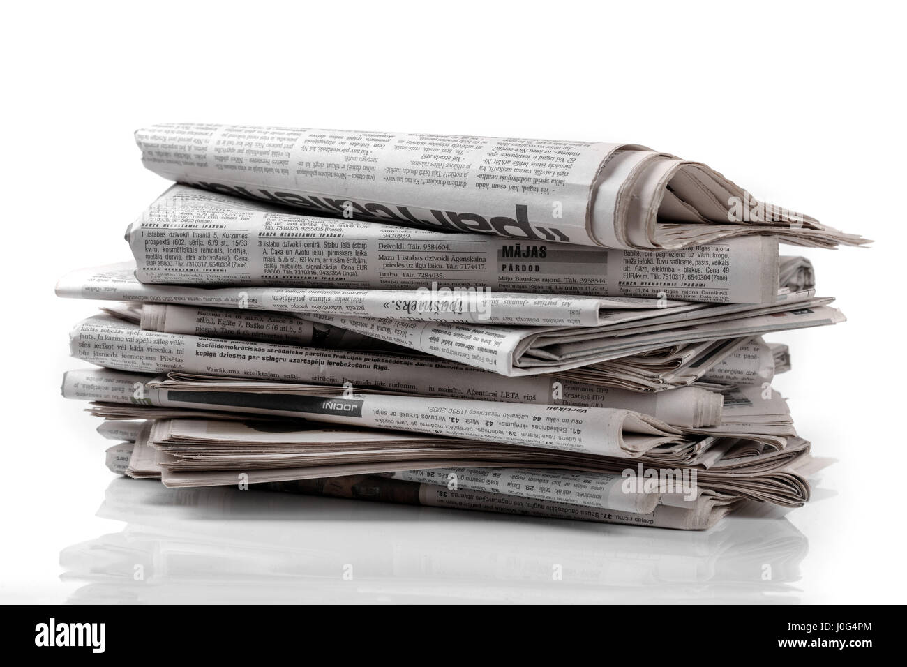 newspaper stack isolated on white background Stock Photo