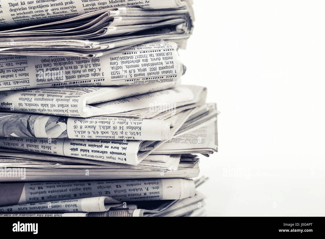 closeup stack of old newspapers Stock Photo