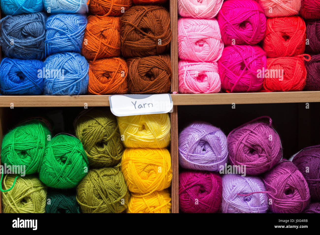 shelves with colorful yarn balls in store Stock Photo Alamy