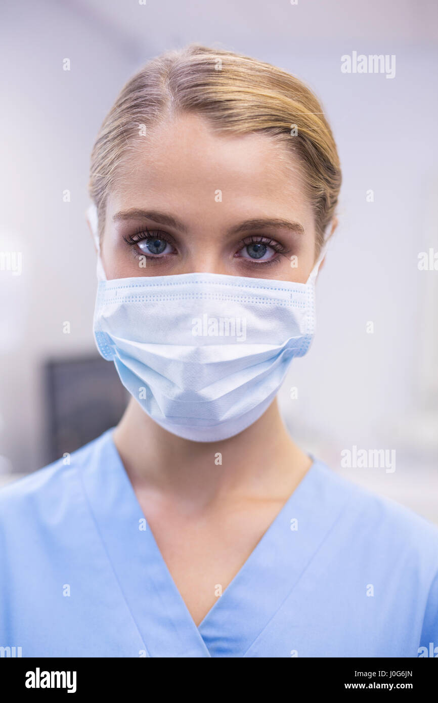 Portrait of female nurse wearing surgical mask in clinic Stock Photo Alamy