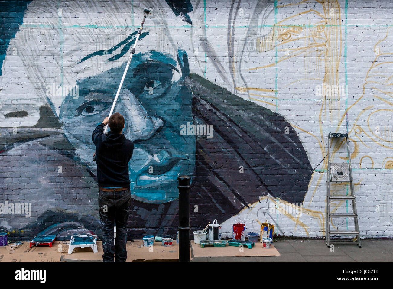 A Graffiti Artist At Work, Brick Lane, London, England Stock Photo