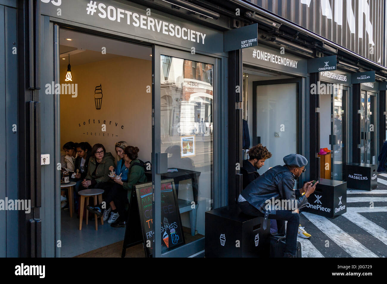 People Sitting Inside and Outside The Soft Serve Society Ice Cream Parlour,  The Boxpark, Shoreditch, London, UK Stock Photo - Alamy