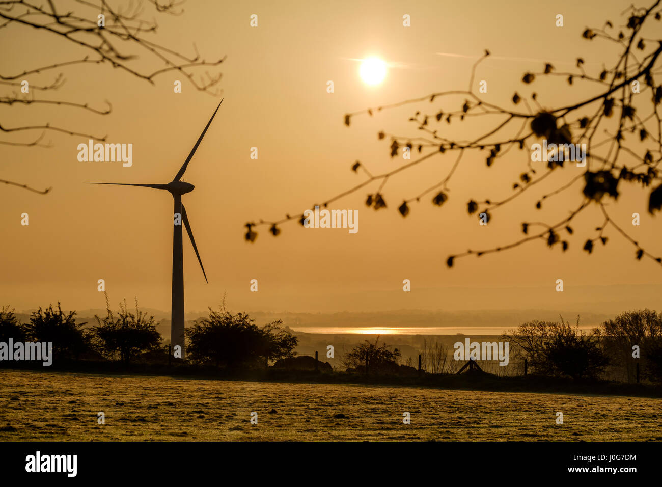 Wind turbine at dawn near River Severn Gloucestershire England UK Stock Photo