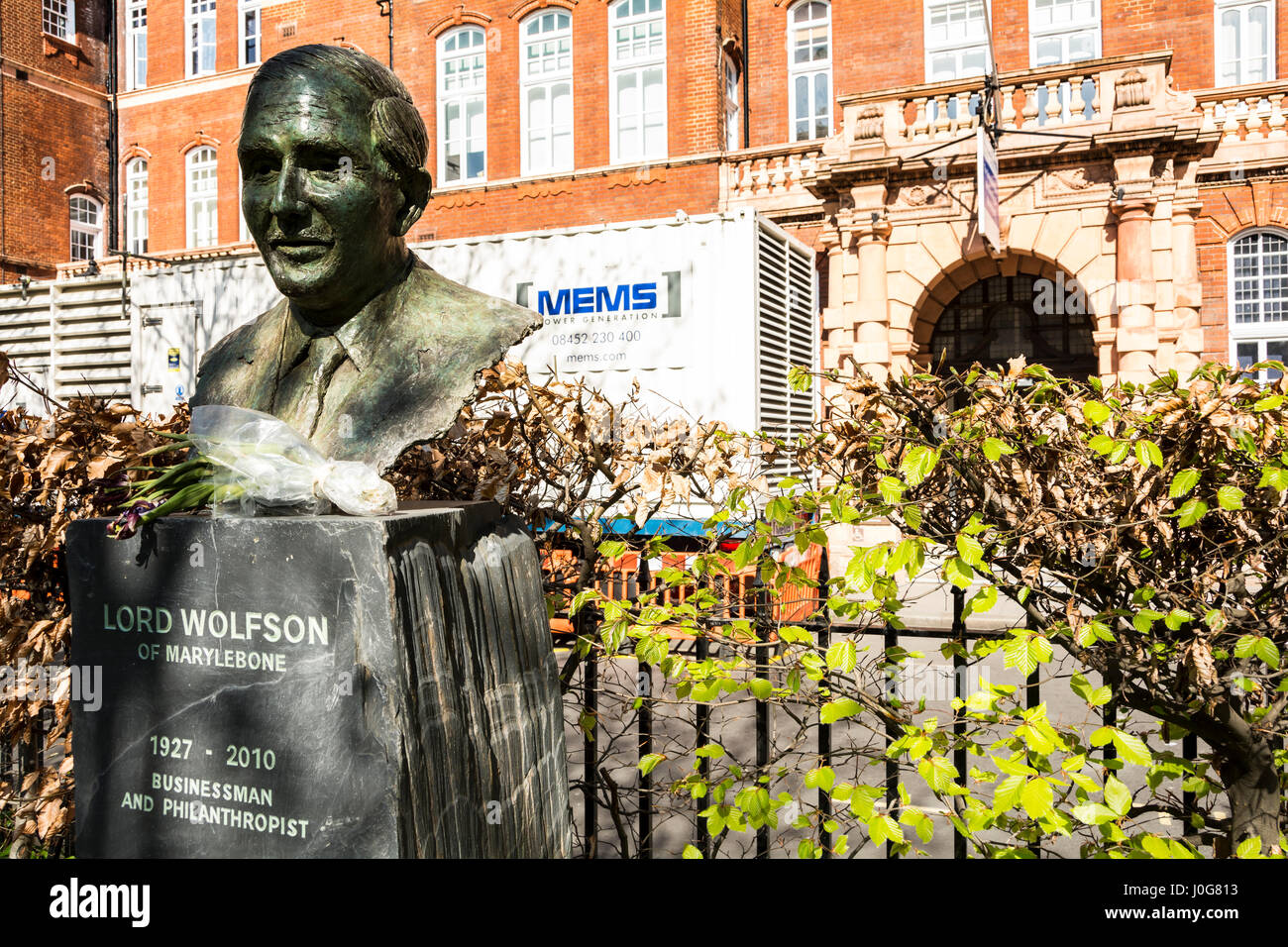 A bronze statue of Lord Wolfson in Queen Square, London, England, UK Stock Photo