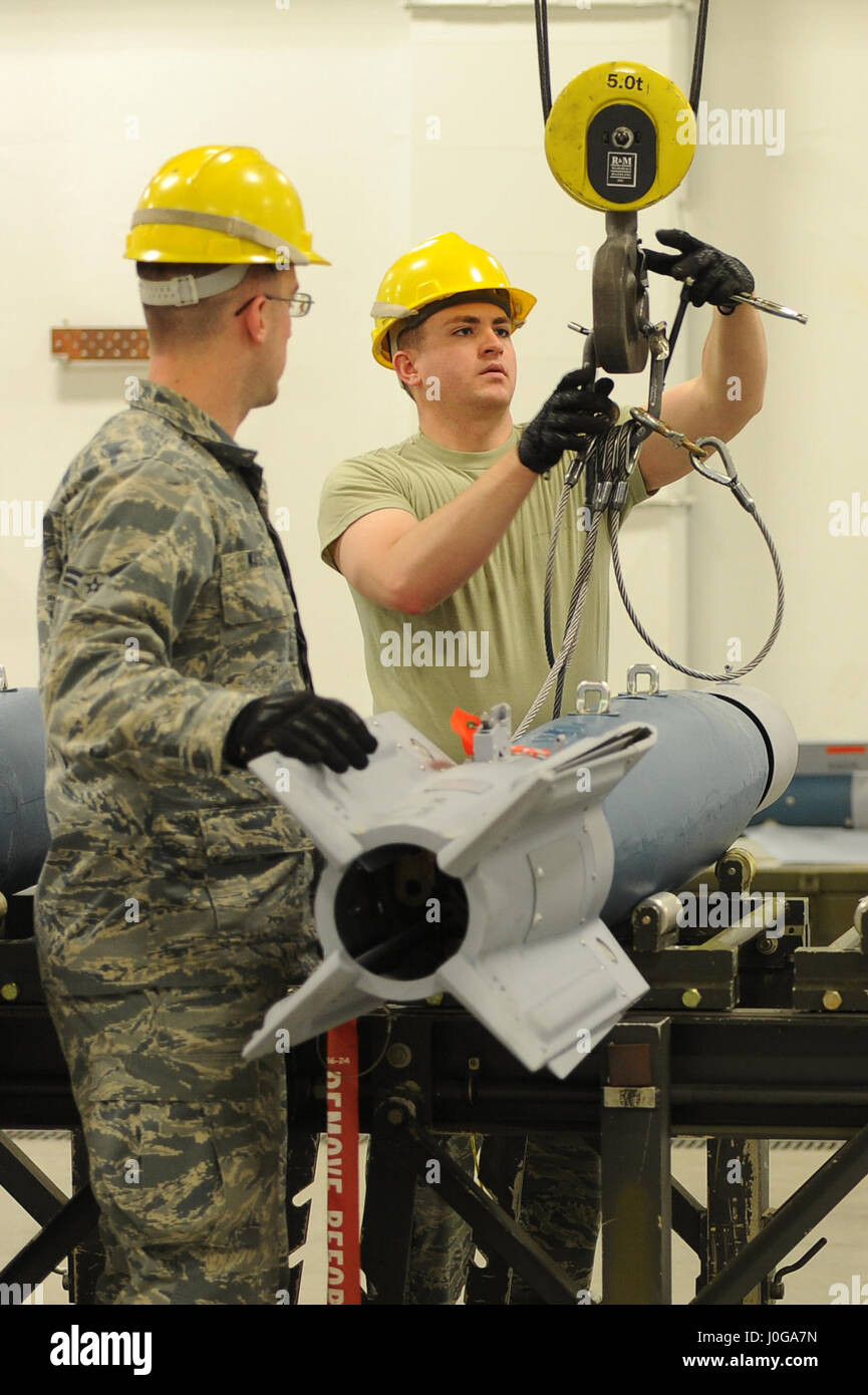An Airman from the 5th Munitions Squadron installs a nose An Airman from the 5th Munitions Squadron installs a nose