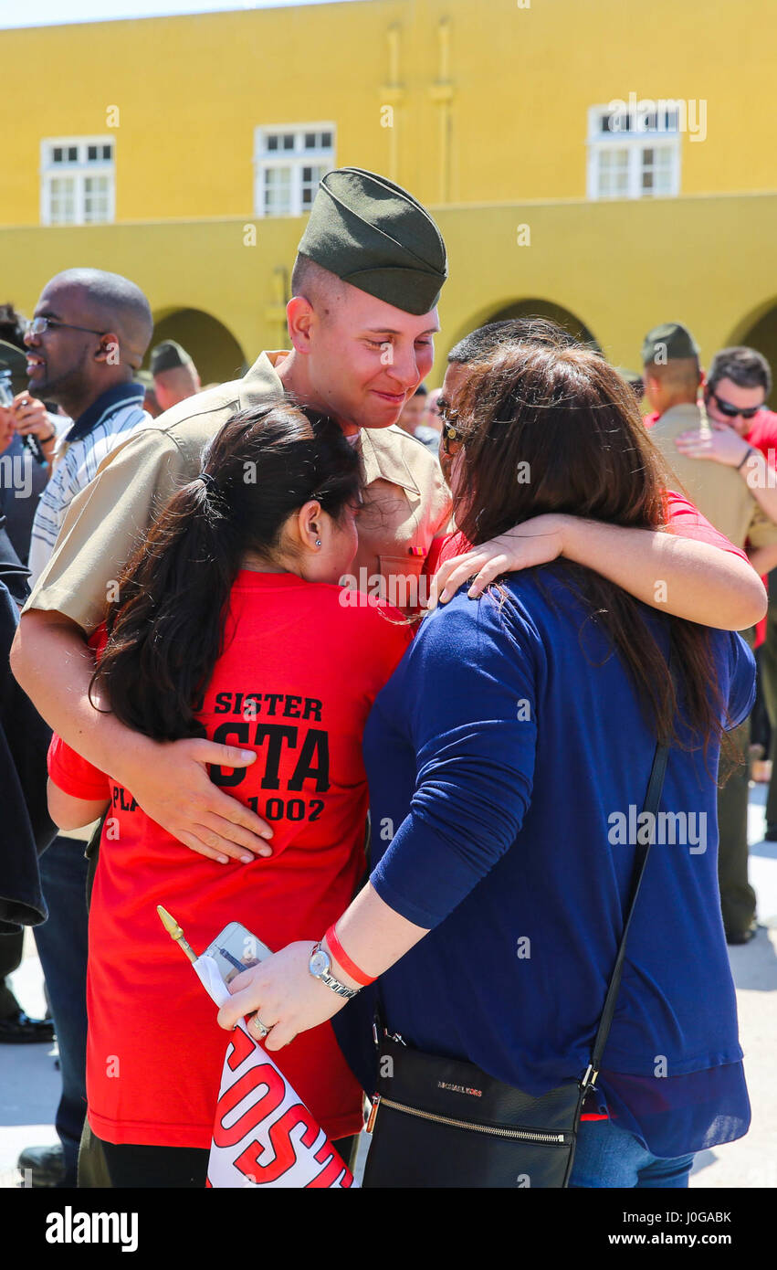 The new Marines of Alpha Company, 1st Recruit Training Battalion, embrace their loved ones during liberty call at Marine Corps Recruit Depot San Diego, today.  After nearly thirteen weeks of training, the Marines of Alpha Company will officially graduate from recruit training tomorrow. Stock Photo