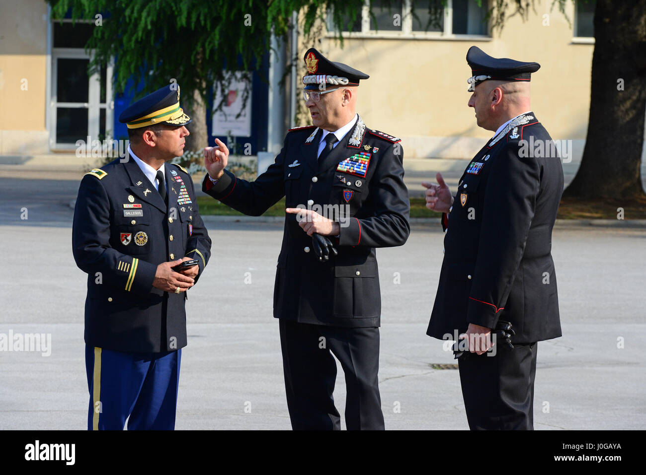 U.S. Army Col. Darius S. Gallegos (left), Center of Excellence for Stability Police Units (CoESPU) deputy director, Lt. Gen Vincenzo Coppola (center), Commanding General “Palidoro” Carabinieri Specialized and Mobile Units and  Italian Carabinieri Col Nicola Mangialavori (right), Chief of Special Branch Department, during the visit NATO JFC-Naples Commander, Admiral Michelle Howard at the CoESPU Vicenza, April 10, 2017. (U.S. Army Photo by Visual Information Specialist Paolo Bovo/released) Stock Photo