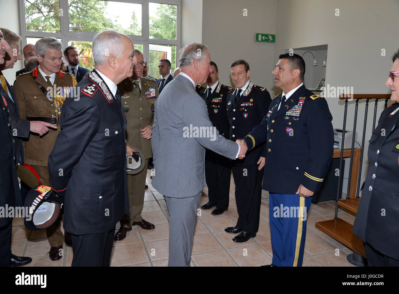 The Royal Highness, Prince Charles, Prince of Wales, meets U.S. Army Col. Darius S. Gallegos, CoESPU deputy director, during visit at Center of Excellence for Stability Police Units (CoESPU) Vicenza, Italy, April 1, 2017. (U.S. Army Photo by Visual Information Specialist Paolo Bovo/released) Stock Photo