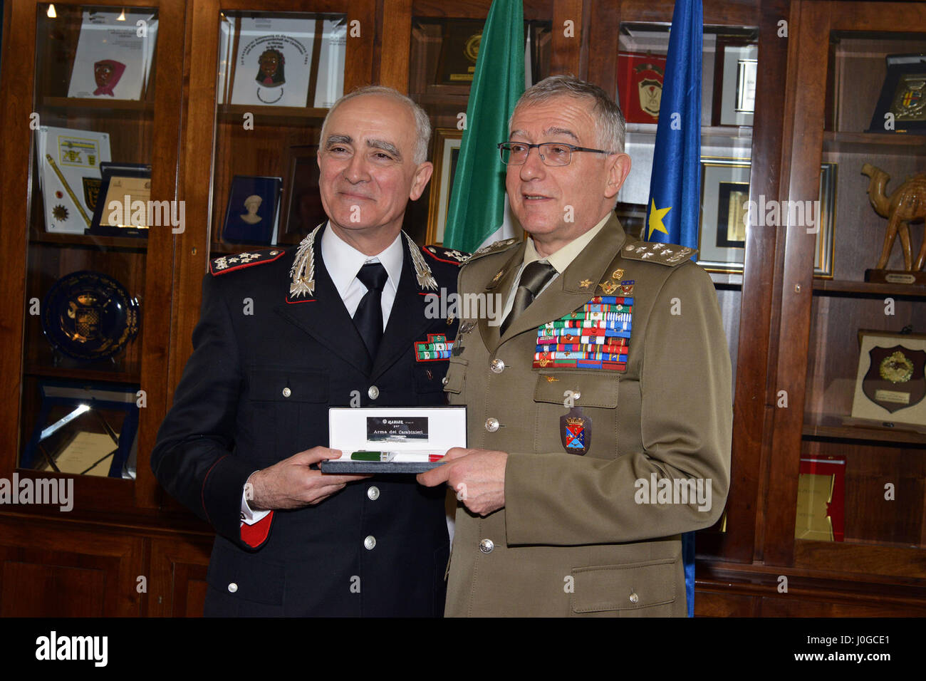Gen. Tullio Del Sette, Italian Carabinieri General Commander (left), presents Carabinieri gift to Gen. Claudio Graziano, Italian Army Chief of Staff (right), during visit at Center of Excellence for Stability Police Units (CoESPU) Vicenza, Italy, April 1, 2017. (U.S. Army Photo by Visual Information Specialist Paolo Bovo/released) Stock Photo