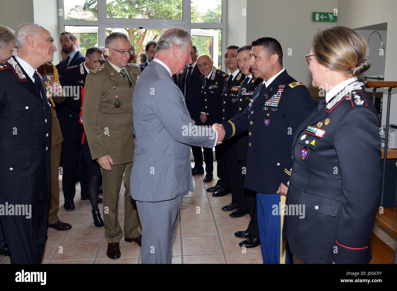 The Royal Highness, Prince Charles, Prince of Wales, meets U.S. Army Col. Darius S. Gallegos, CoESPU deputy director, during visit at Center of Excellence for Stability Police Units (CoESPU) Vicenza, Italy, April 1, 2017. (U.S. Army Photo by Visual Information Specialist Antonio Bedin/released) Stock Photo