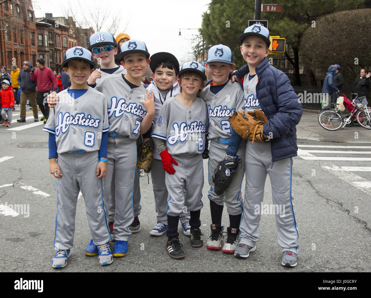 Parents and little leaguers march in the annual Little League Parade in Park Slope Brooklyn to kick off the 2017 baseball season in Brooklyn, NY. Stock Photo