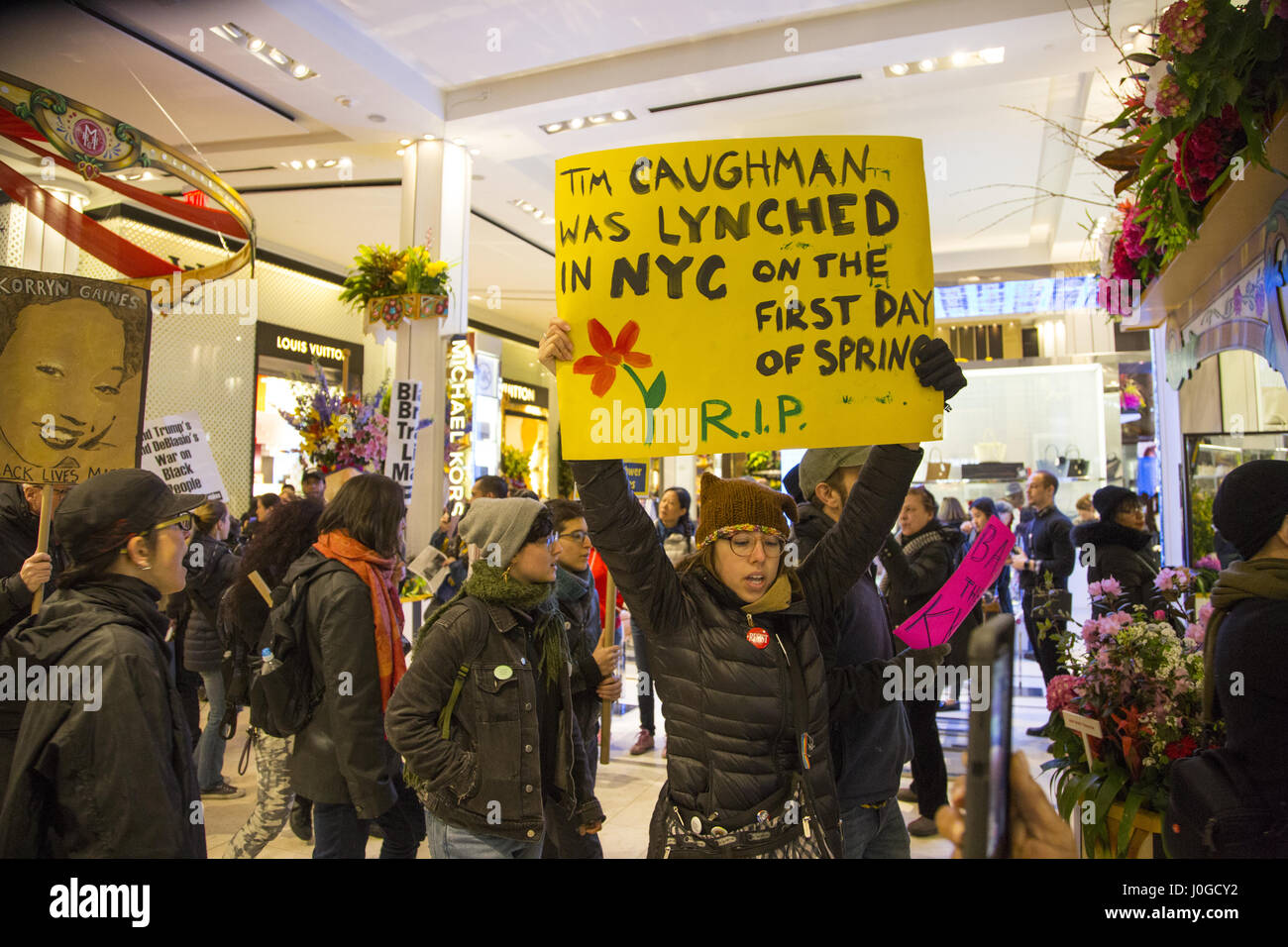 Black Lives Matter demonstrators and others protesting police brutality & bias against minorities march through the ground floor of Macy's Department Store at 34th and Broadway in Manhattan, New York City. Stock Photo