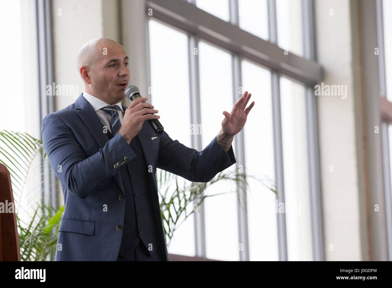 Rapper Pitbull introduces U.S. Secretary of Education Betsy DeVos at the SLAM  charter school he supports in Little Havana April 6, 2017 in Miami, Florida. The controversial education secretary made several stops including her first visit to a public university, a private christian school and the charter school. Stock Photo