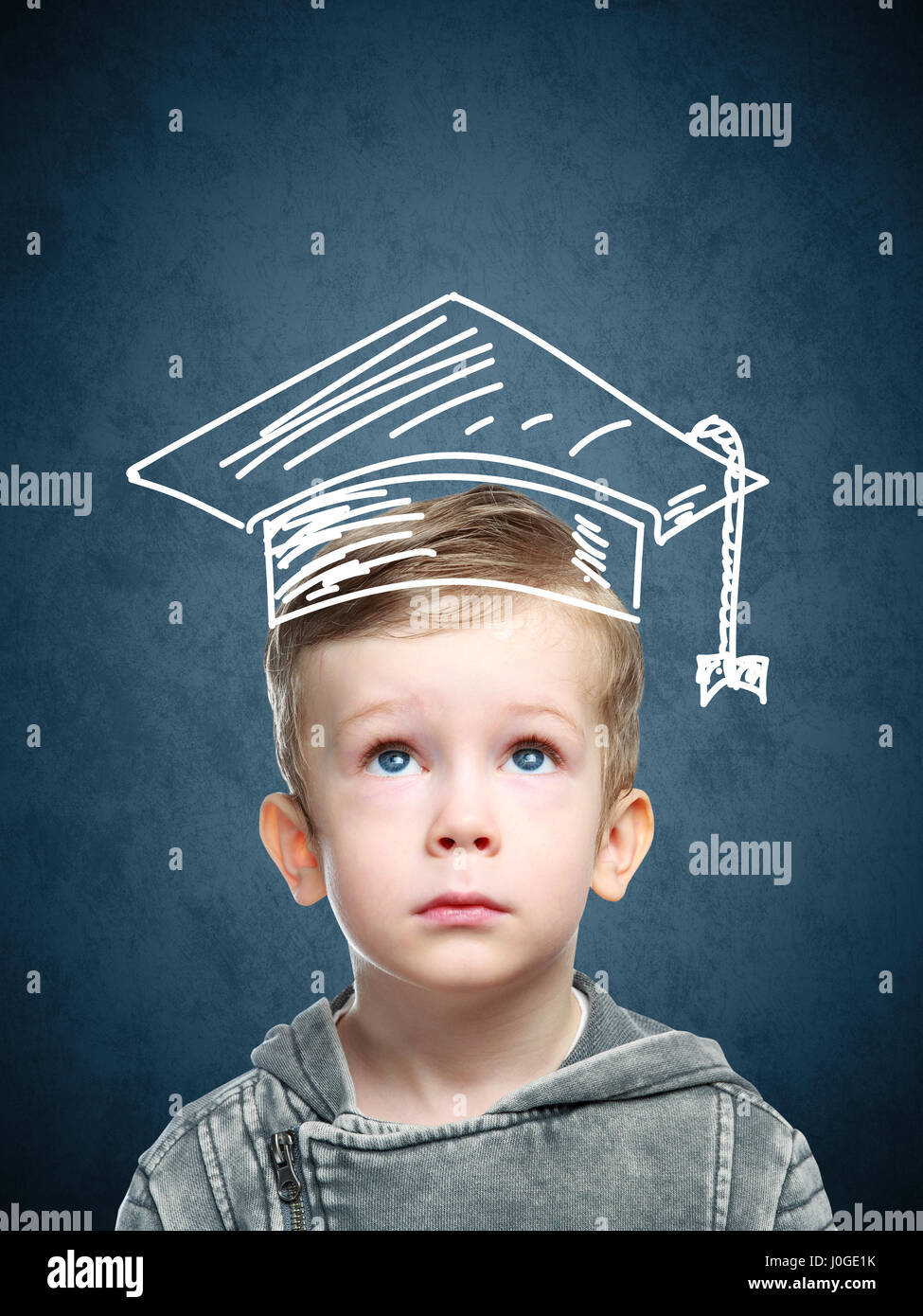 Smart child in a drawn student hat Stock Photo - Alamy