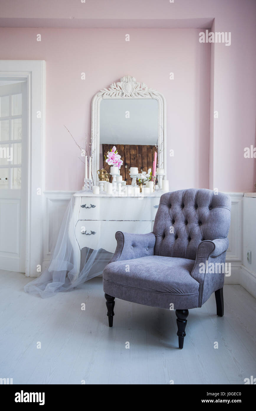 Classical armchair and mirror table at living room interior Stock Photo ...