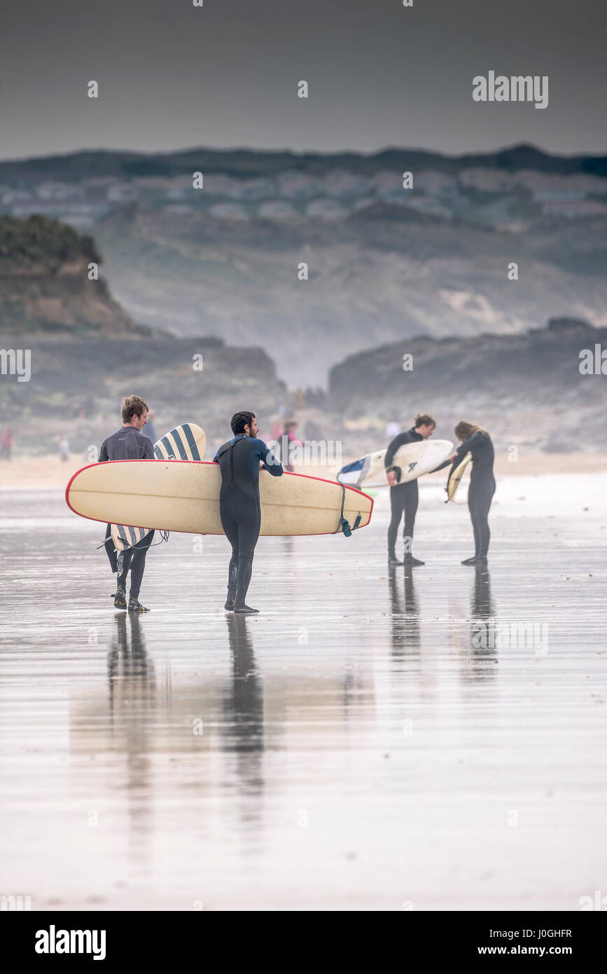 Gwithian Towans beach Surfers Longboards Surfboards Walking Leisure activity Coast Coastal scene Cornwall Stock Photo