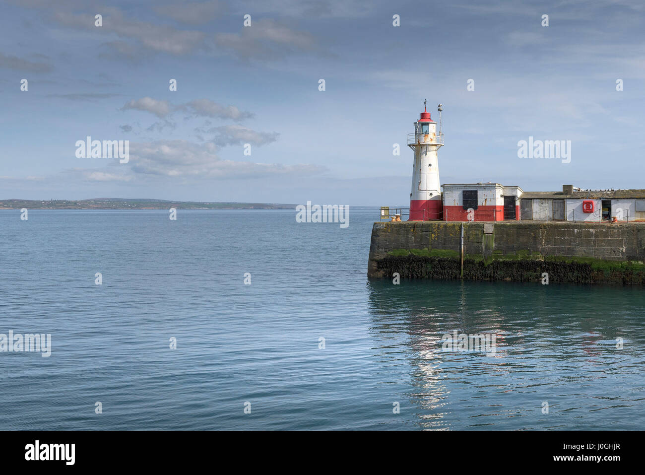 Newlyn Lighthouse Entrance Fishing Port Harbour Harbor Sea Quay Coast Coastal scene Cornwall Stock Photo