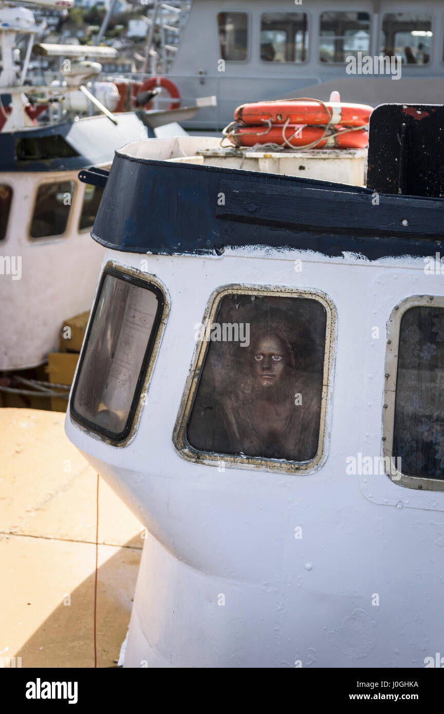 Fishing boat Face in a window Mannequin Strange Unsettling Disturbing Stock Photo