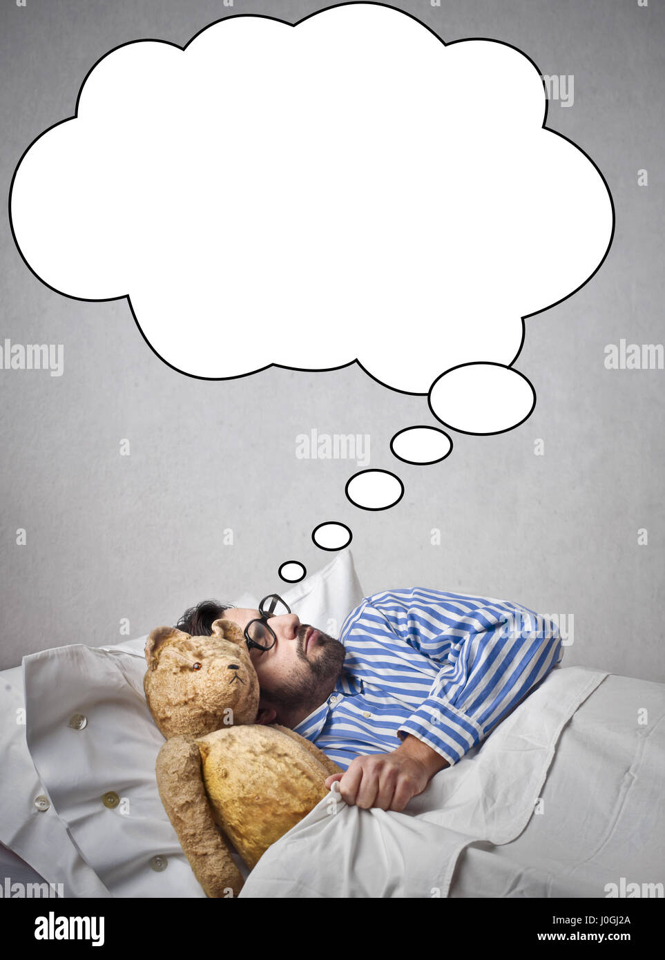 Man in bed dreaming Stock Photo