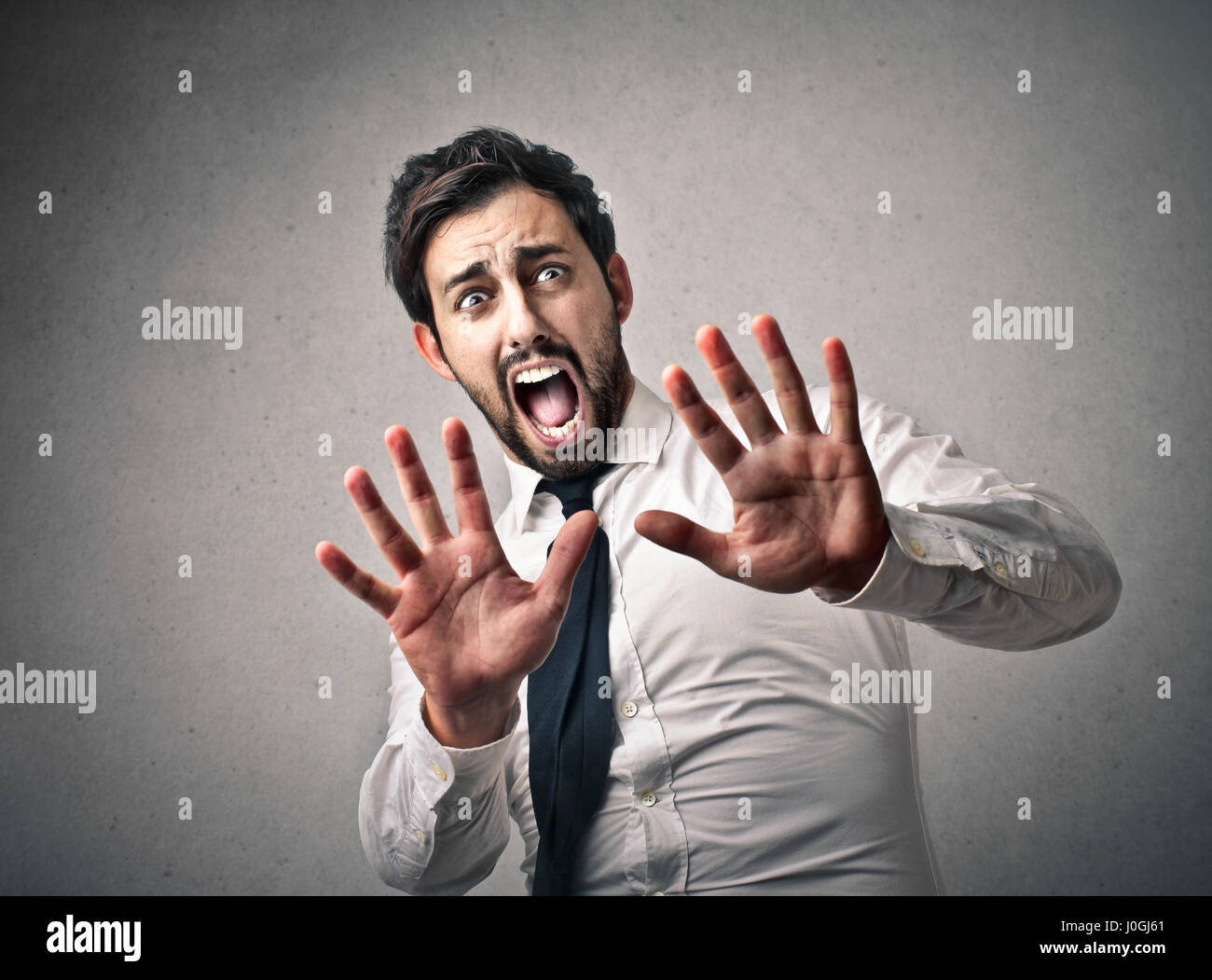 Businessman being scared Stock Photo