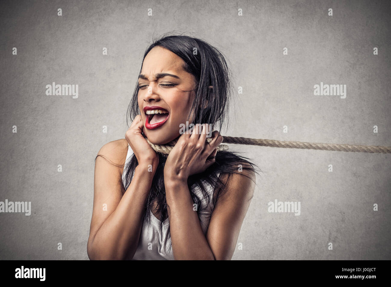 Woman with rope around her neck Stock Photo Alamy