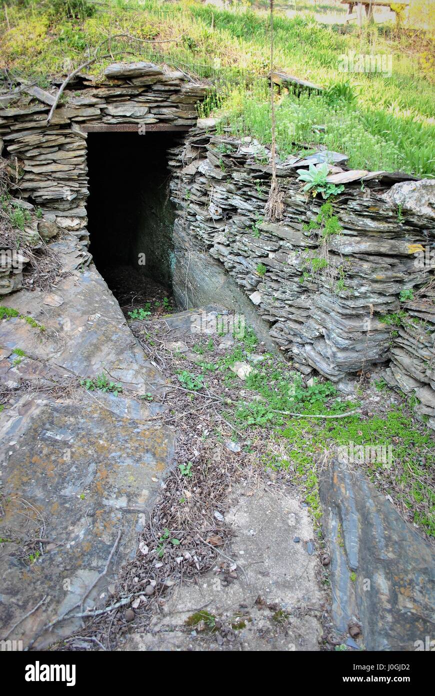 Cave found under a hill Stock Photo
