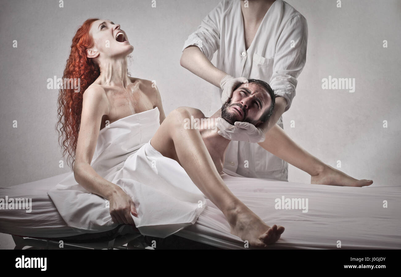 Woman giving birth to adult man Stock Photo