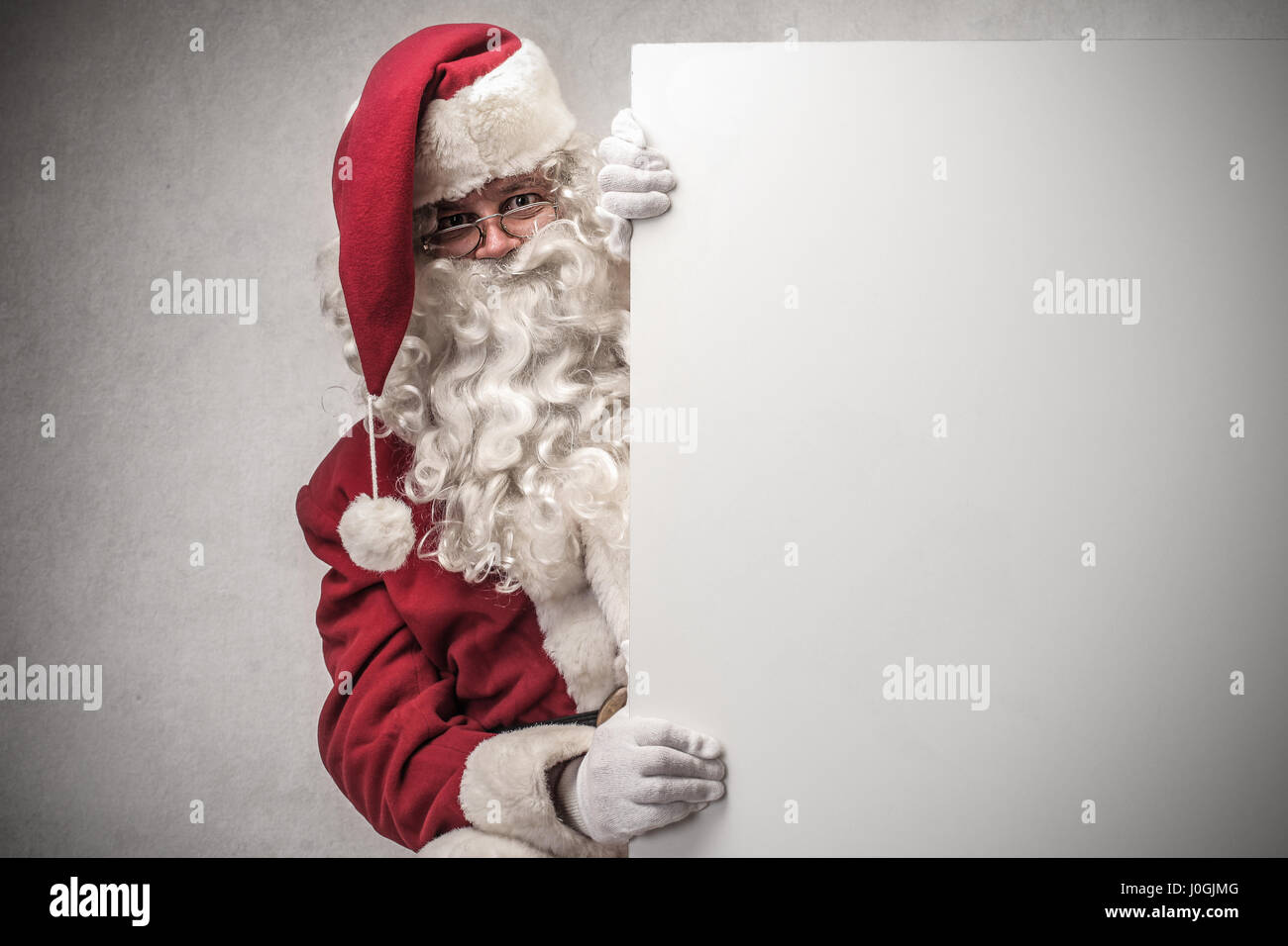 Santa Claus with white board Stock Photo - Alamy