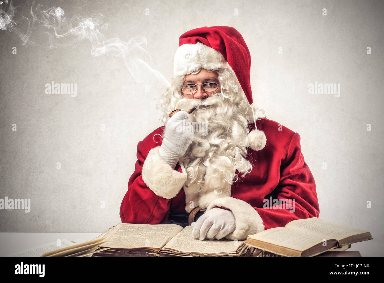 Santa Claus smoking pipe Stock Photo