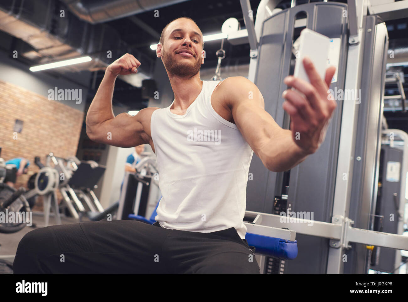 Man Taking A Selfie Of His Muscles At The Gym Stock Photo - Download Image  Now - Gym, Selfie, Health Club - iStock