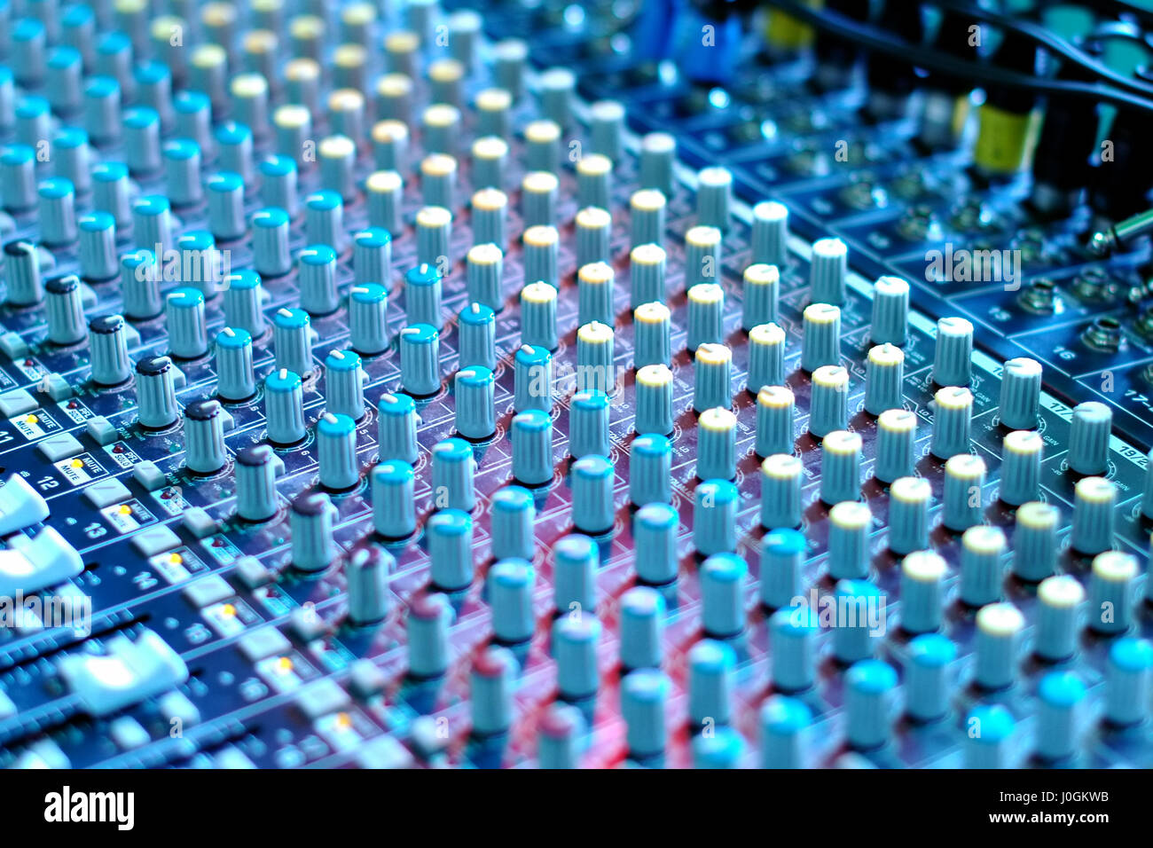 soundboard mixing desk under blue theater lighting Stock Photo Alamy