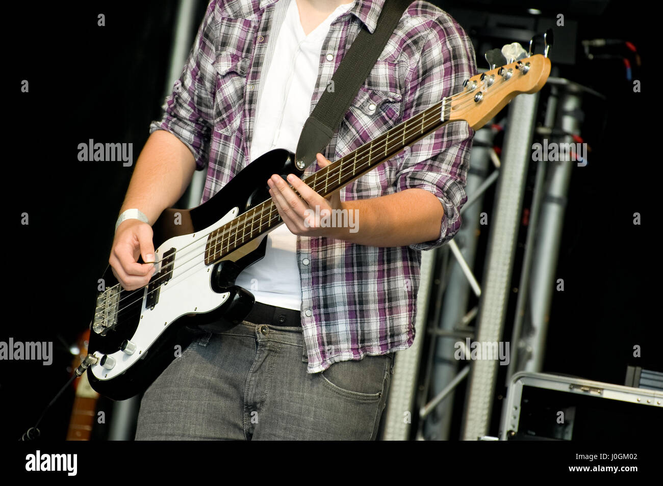 musician playing bass guitar on stage Stock Photo Alamy