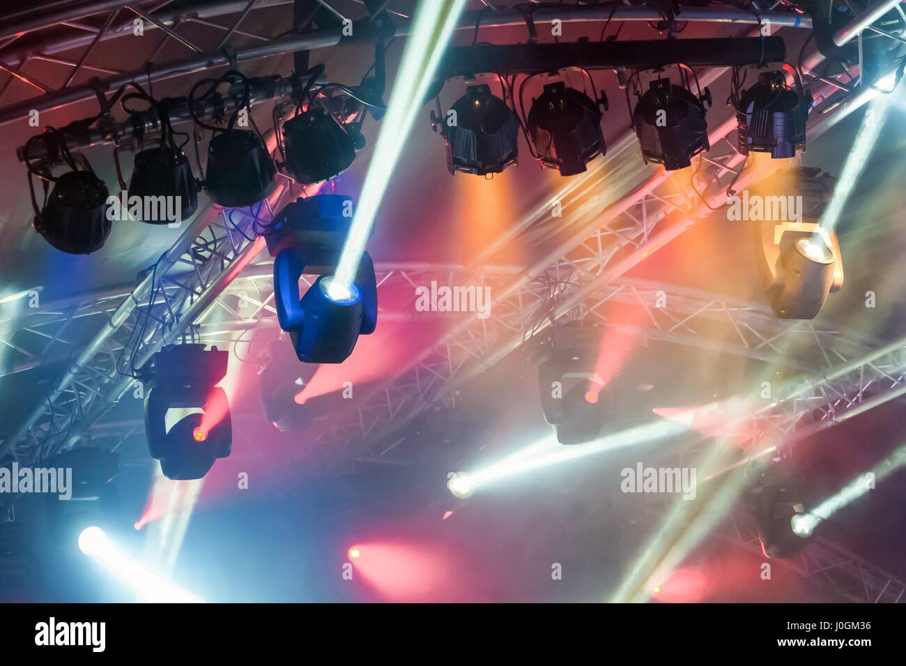 multiple spotlights on a theatre stage lighting rig Stock Photo