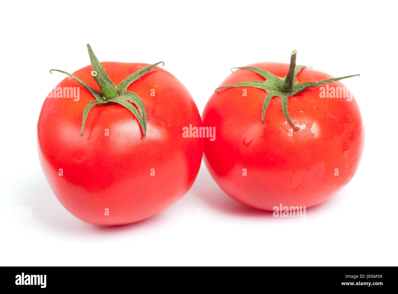 Tomatoes isolated on white background Stock Photo - Alamy