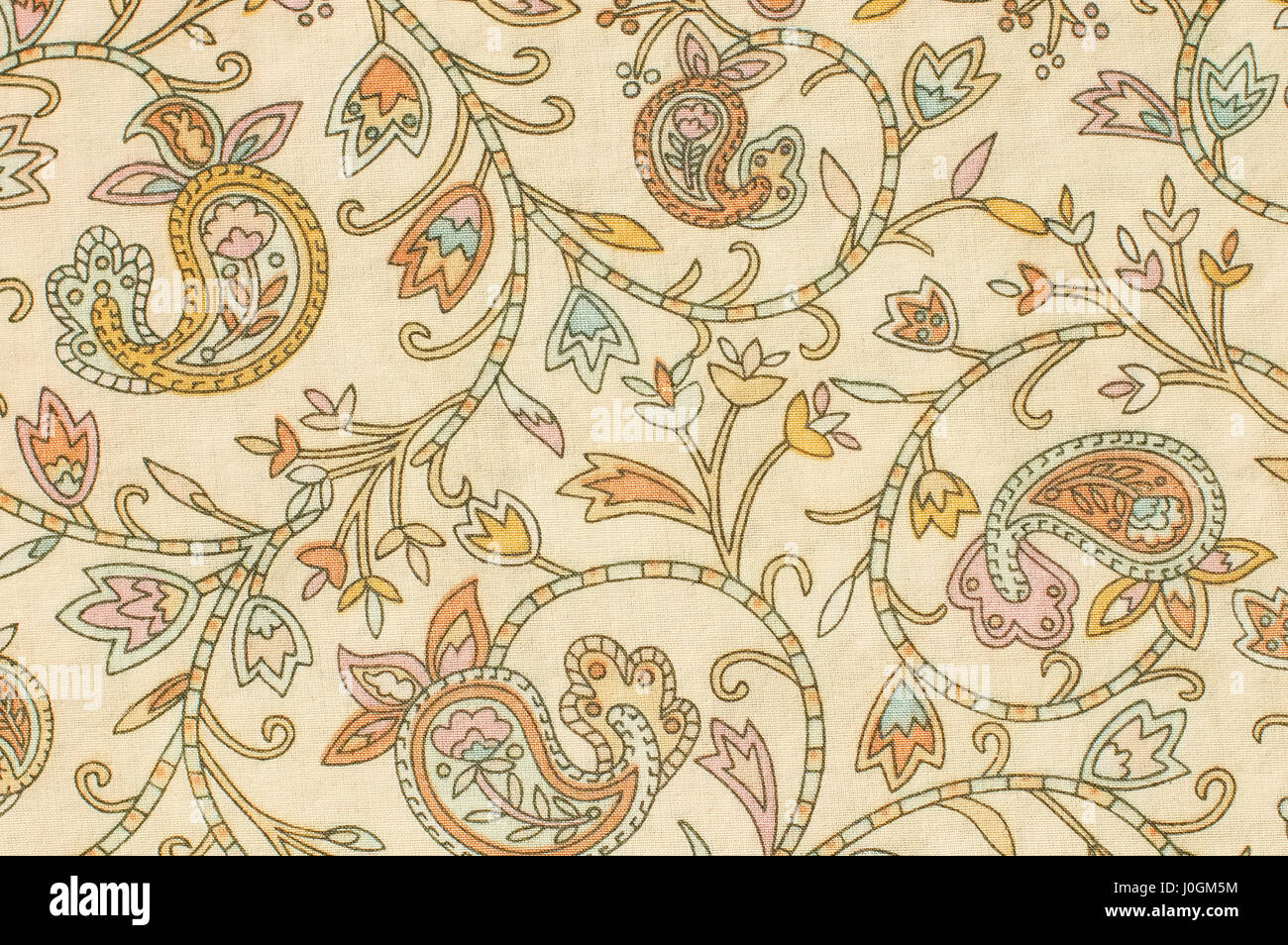 colorful paisley print fabric background on a foundation of beige Stock Photo