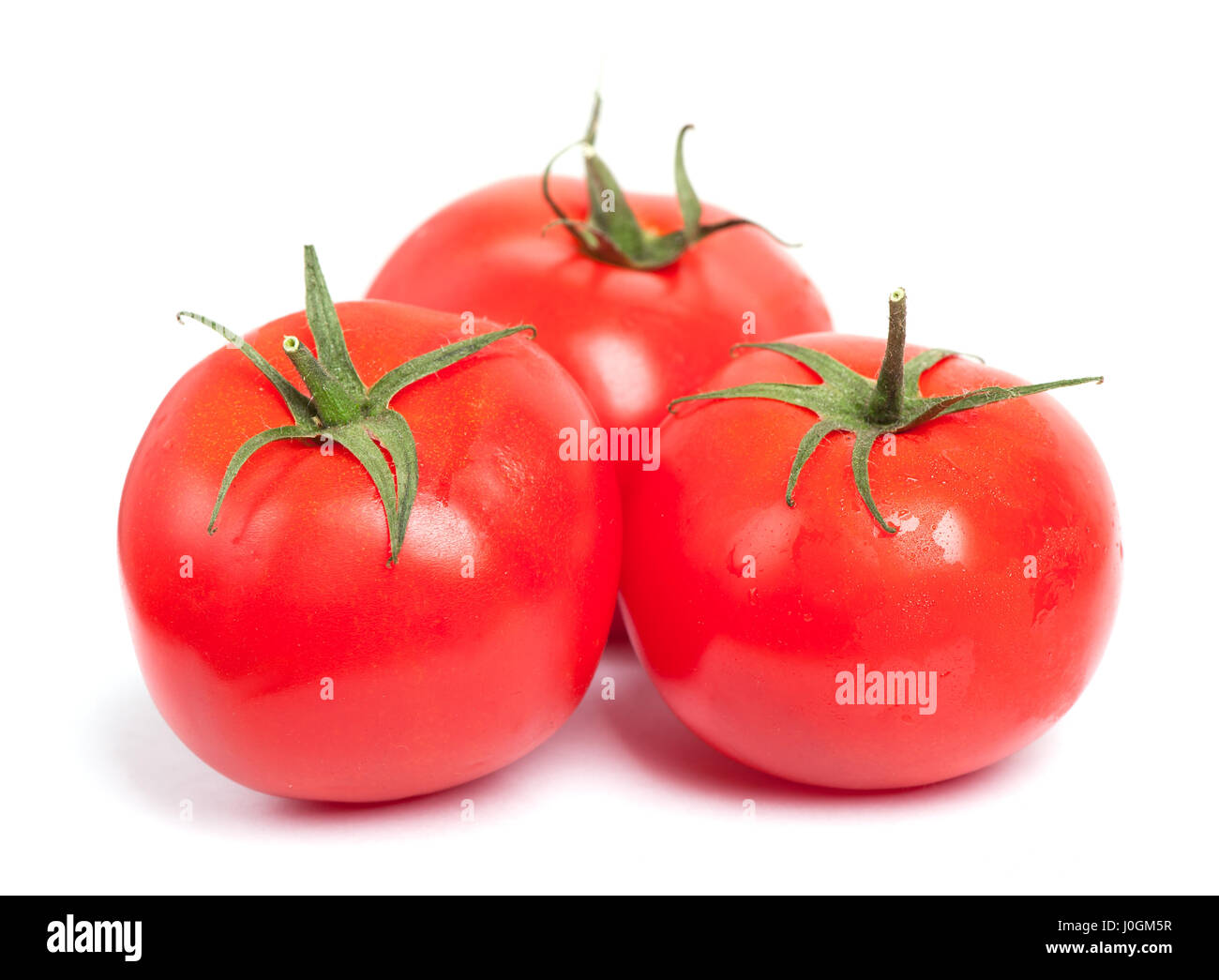 Tomatoes isolated on white background Stock Photo - Alamy