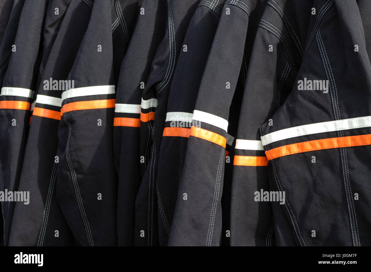 rack of reflective motorcycle safety jackets Stock Photo Alamy