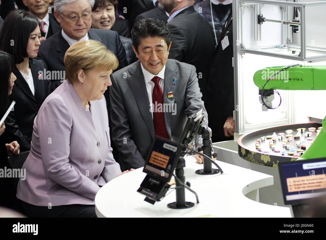 Hanover, Germany. 20th March, 2017. opening walk with Angela Merkel, Federal Cancellor of Germany, and Shinzo Abe, Prime Minister of Japan, exhibition stand Hitachi in Central Partner Country Pavillion Japan, CeBIT 2017, ICT trade fair, lead theme 'd!conomy - no limits'. Photocredit: Christian Lademann Stock Photo