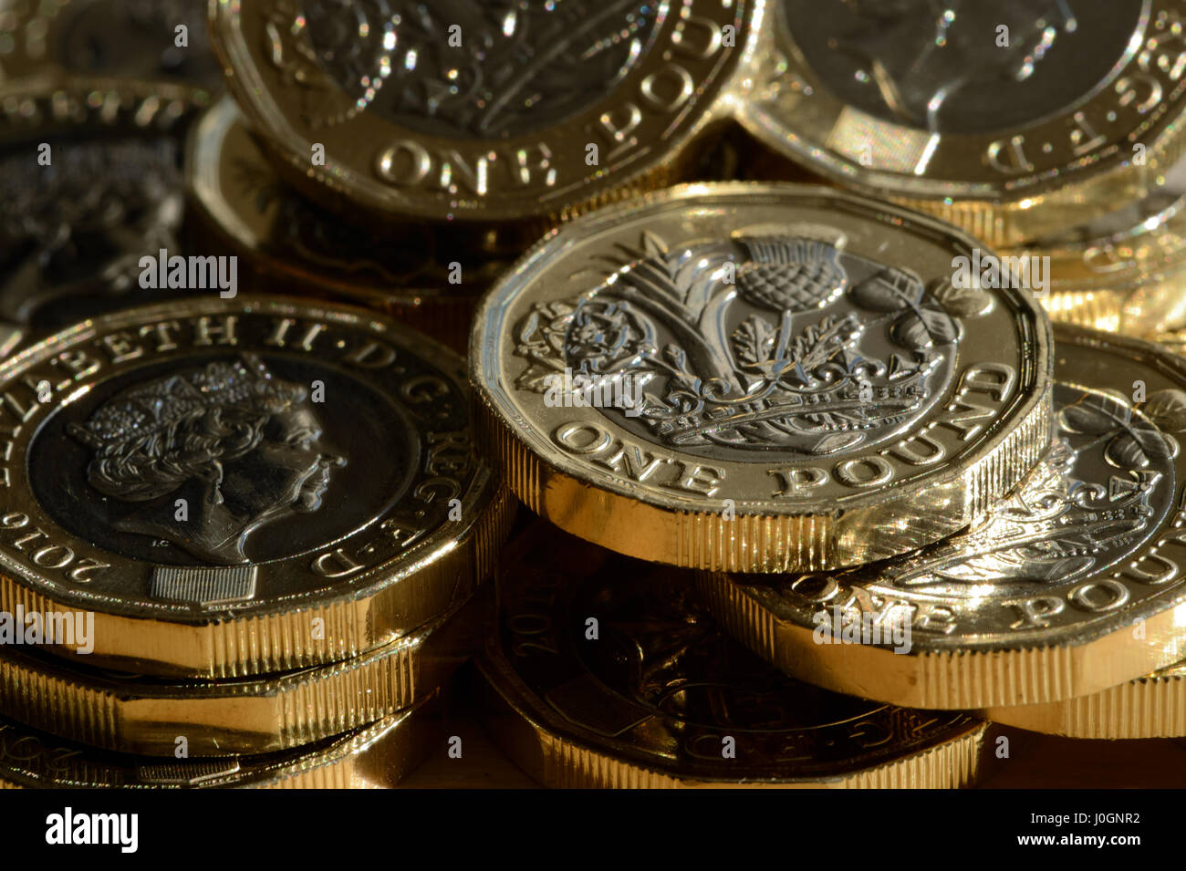 New £1 coin is 12 sided and is the most secure coin in the world - British new £1 coin is bimetallic with latent image that changes from £ symbol - 1h Stock Photo