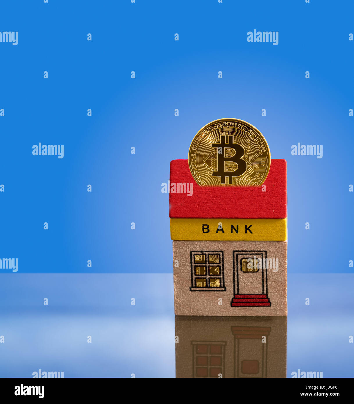 Toy bank building with bitcoin assets Stock Photo