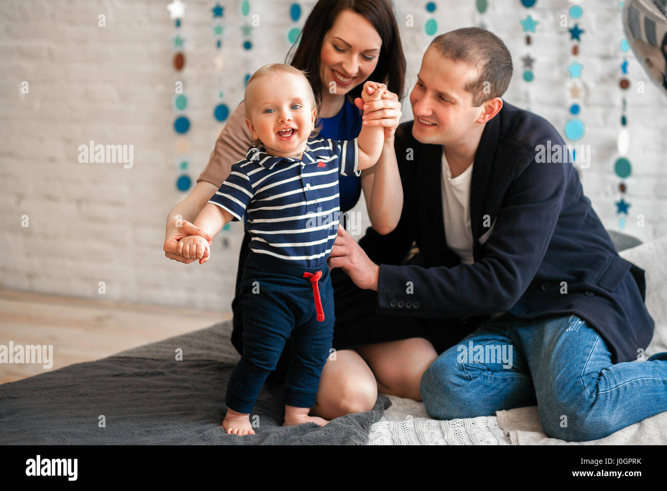 Young Parents Teach Baby To Walk They Laugh Fun Stock Photo