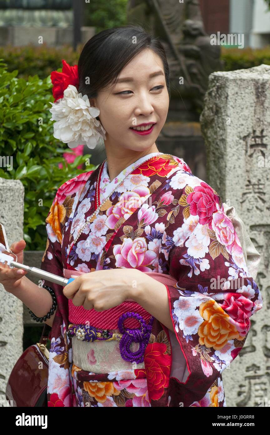 Young Japanese woman wearing a traditional dress called Kimono at Senso