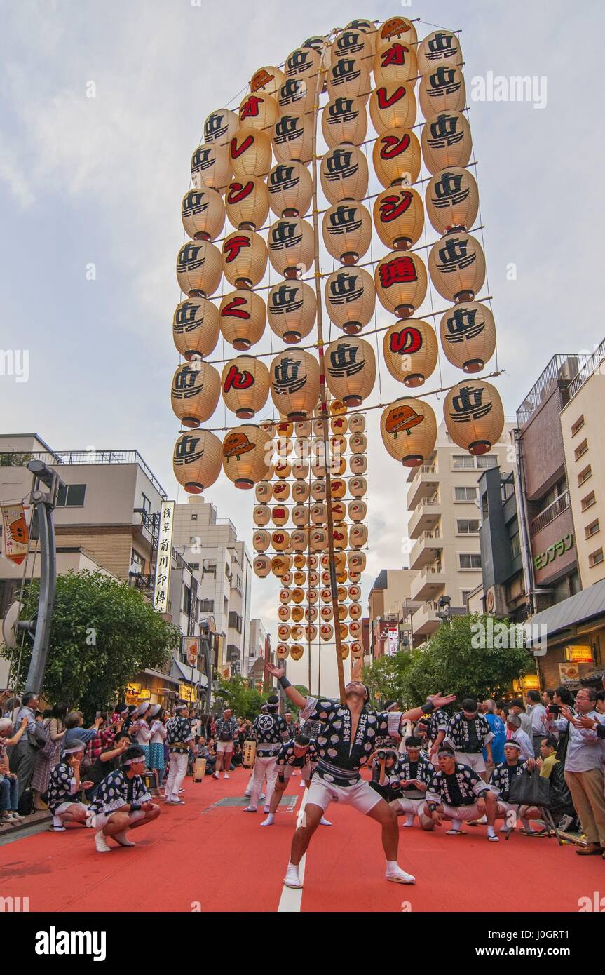 Lantern poles weighing up to 60 kilograms are balanced during the Kanto Matsuri festival in Akita Tokyo Japan Stock Photo