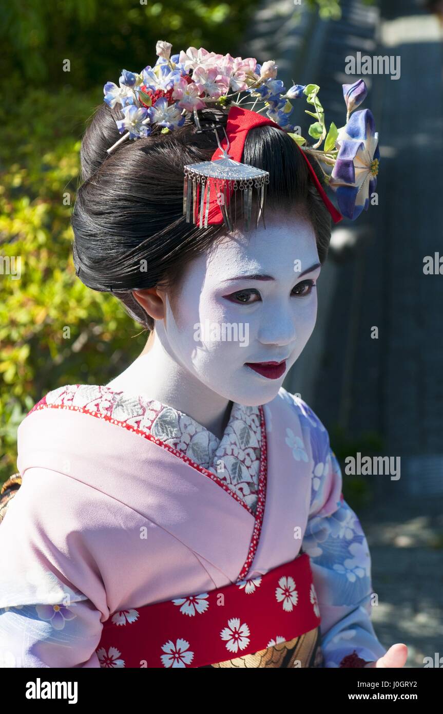 Young beautiful Japanese women called Maiko wear a traditional dress ...