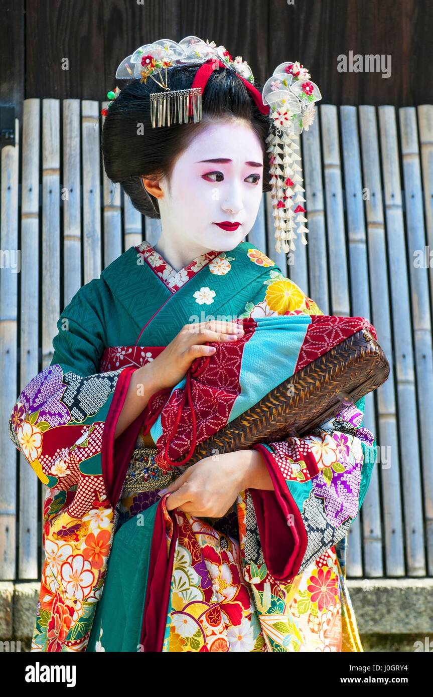 Young beautiful Japanese women called Maiko wear a traditional dress ...