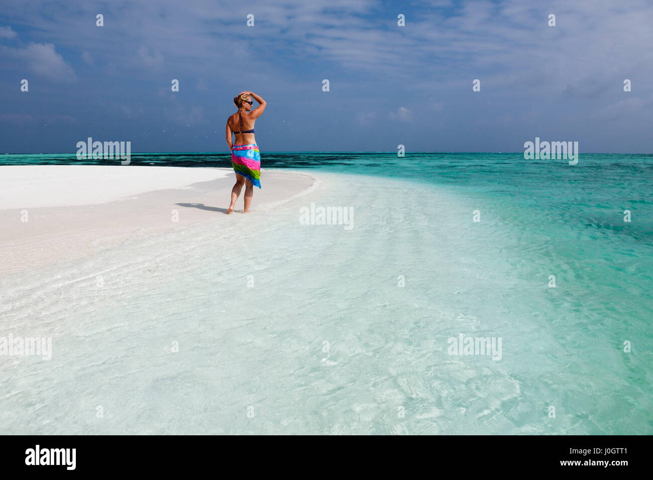 Female Tourist on Sand Bank, Felidhu Atoll, Maldives Stock Photo