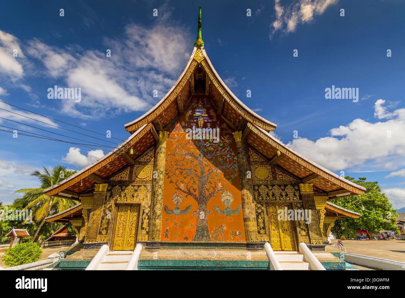 Xieng Tree The west fasade with its painted-mosaic Tree of Life at Wat Xieng Thong ...